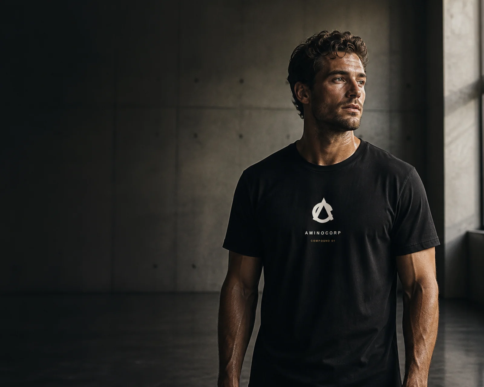 Athlete wearing the black AminoCorp Core Mark Tee after training